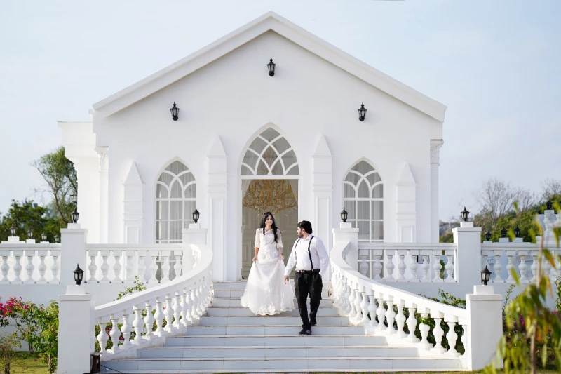 Groom and bride holding hands on their pre-wedding photoshoot at Bangalore Film City.
