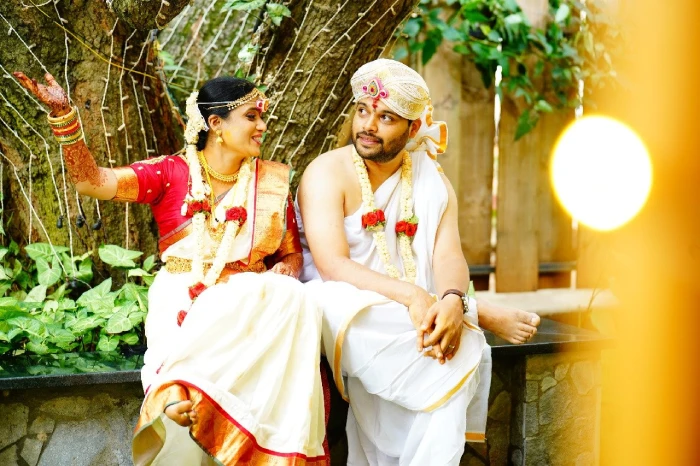 Couple talking with each other on their wedding day, taken bySidphoto